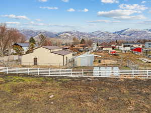 View of yard featuring a mountain view and an outdoor structure