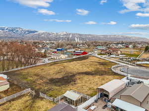 Birds eye view of property with a mountain view