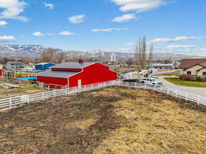 View of yard featuring a mountain view, a rural view, and an outdoor structure