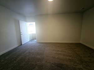 View of carpeted spare room