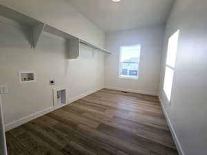 Washroom featuring electric dryer hookup, hookup for a washing machine, and hardwood / wood-style floors