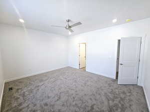 Spare room featuring ceiling fan and carpet floors