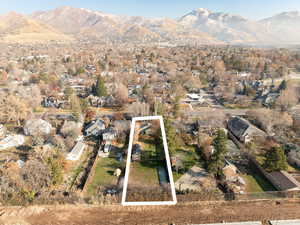 Birds eye view of property with a mountain view