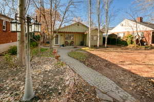 Back of property with a carport