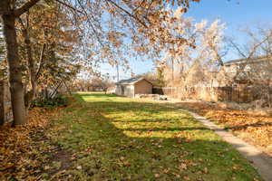 View of yard featuring a storage shed