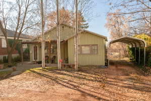 Exterior space featuring a carport