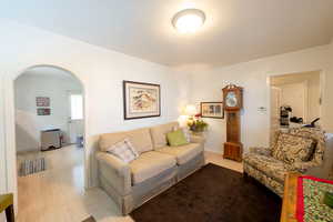 Living room with light hardwood / wood-style flooring