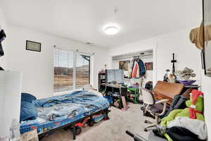 Bedroom featuring a closet and carpet floors