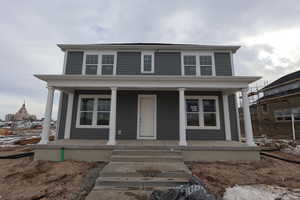 View of front of house with covered porch