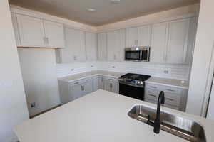 Upgraded cabinetry, soft close drawers and doors, quartz countertops, decorative tile backsplash, upgreded GE stainless steel appliances