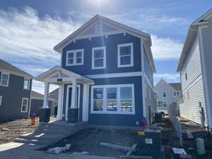 View of front of home with central AC