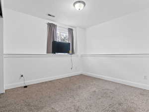 Spare room with carpet floors