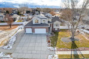 View of front of house featuring a mountain view and a garage