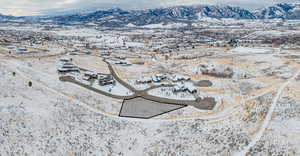 Snowy aerial view with a mountain view