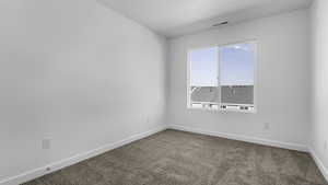 View of carpeted spare room