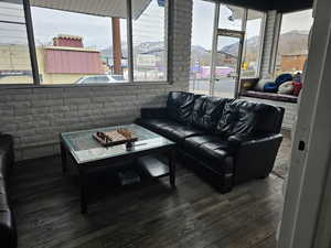 Living room with a mountain view and dark hardwood / wood-style floors