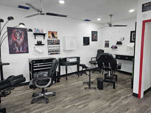 Office featuring ceiling fan and dark wood-type flooring