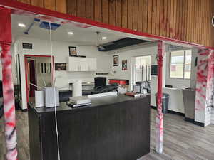 Home office with light hardwood / wood-style flooring