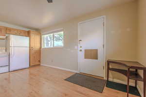 Doorway to outside featuring light hardwood / wood-style flooring