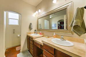 Bathroom featuring hardwood / wood-style floors and vanity