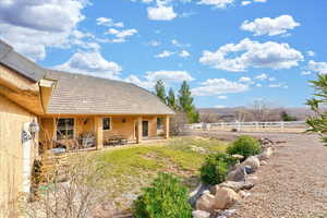 View of yard featuring a mountain view and a rural view