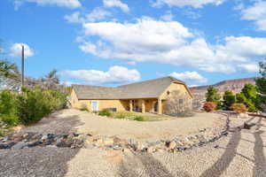 View of side of home featuring a mountain view