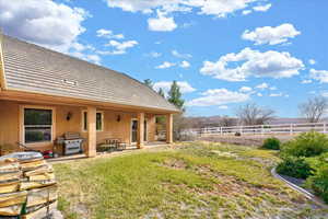 View of yard with a patio area