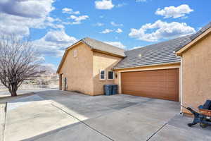 View of home's exterior with a mountain view and a garage