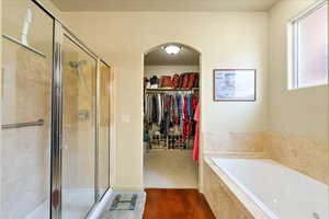 Bathroom featuring separate shower and tub