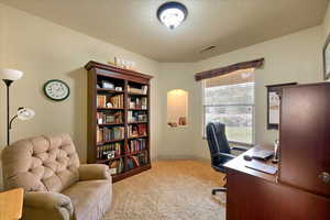 View of carpeted home office