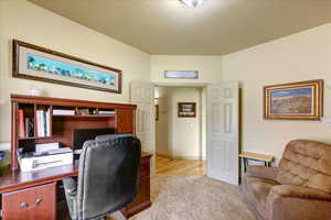 Office area featuring light hardwood / wood-style floors