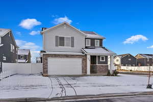 Front of property with a garage