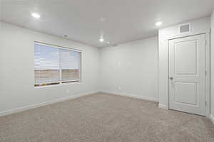 View of carpeted spare room