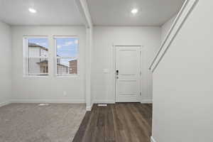 Foyer featuring dark wood-type flooring