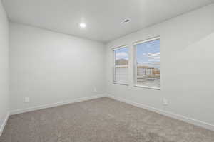 Empty room with carpet floors