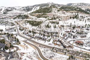 Snowy aerial view featuring a mountain view