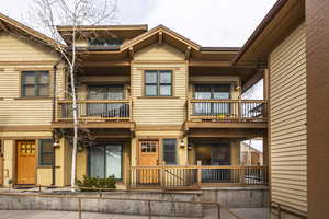 View of front of home with a balcony