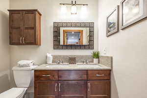 Bathroom featuring vanity and toilet