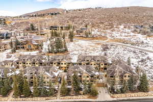 Snowy aerial view featuring a mountain view