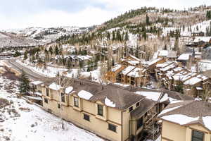 Snowy aerial view with a mountain view