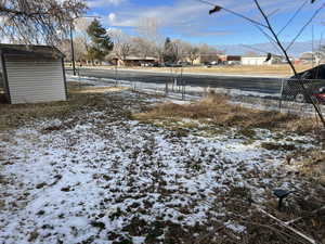 View of yard covered in snow