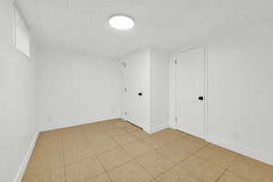 View of tiled basement bedroom