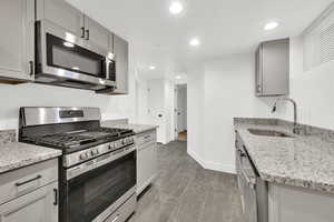 Basement Kitchen with new Cabinets, stainless appliances and granite counters