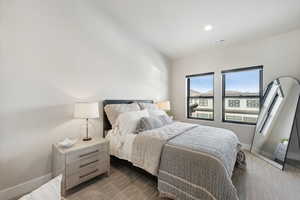 Bedroom featuring dark colored carpet