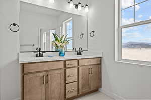 Bathroom featuring vanity and a mountain view