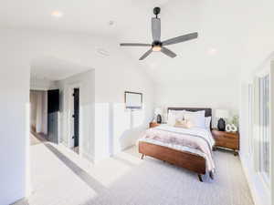 Bedroom with multiple windows, ceiling fan, light colored carpet, and vaulted ceiling