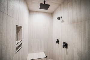 Bathroom featuring a tile shower