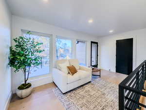 Living room with light hardwood / wood-style floors