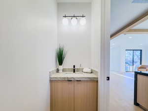 Bathroom featuring hardwood / wood-style floors and vanity