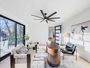 Living room featuring ceiling fan and light wood-type flooring